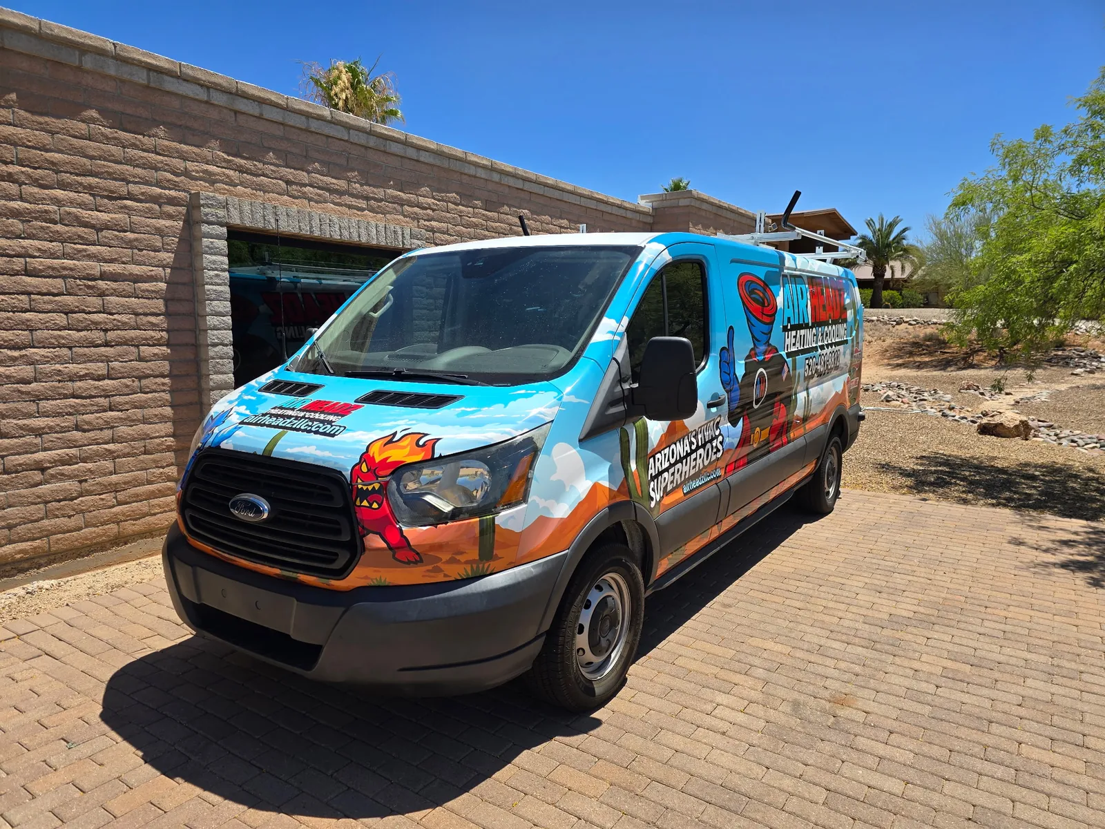 AirHeadz superhero-wrapped service van at a Tucson home